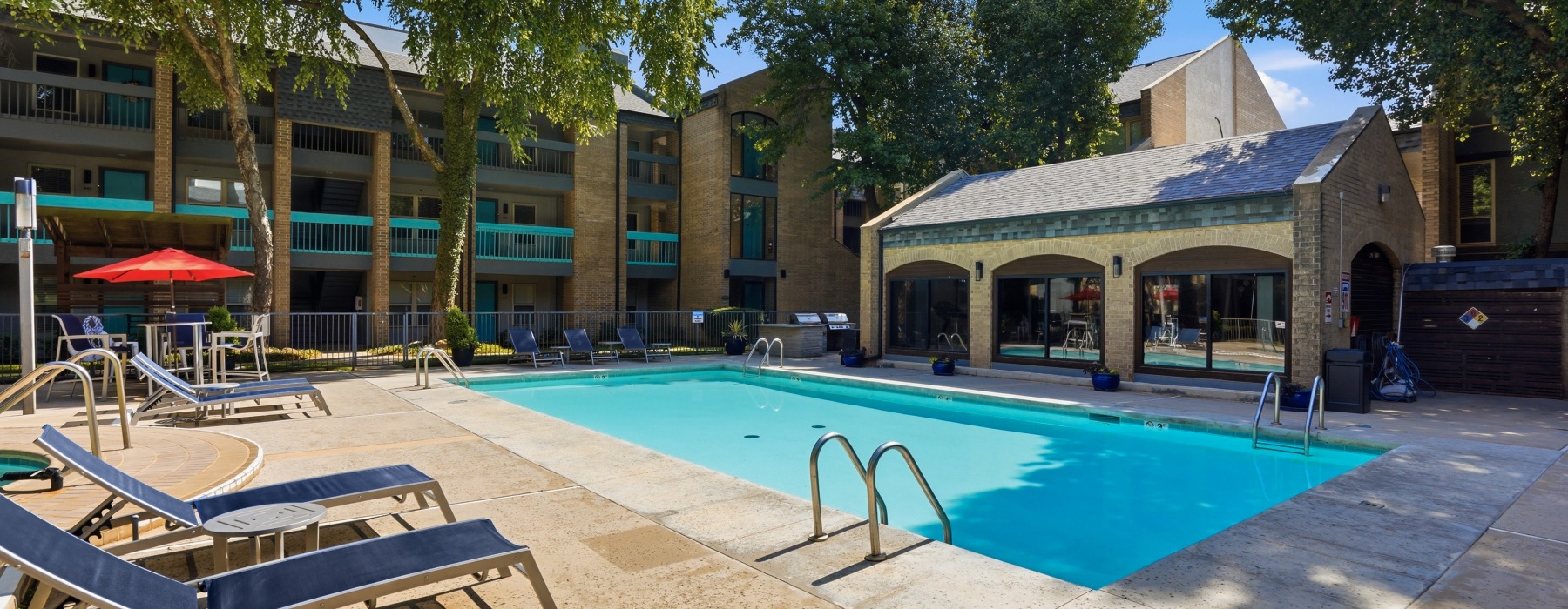 Oasis Pool with Tanning Loungers and Umbrellas for shade 