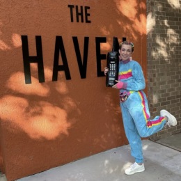 a person standing beside a wall