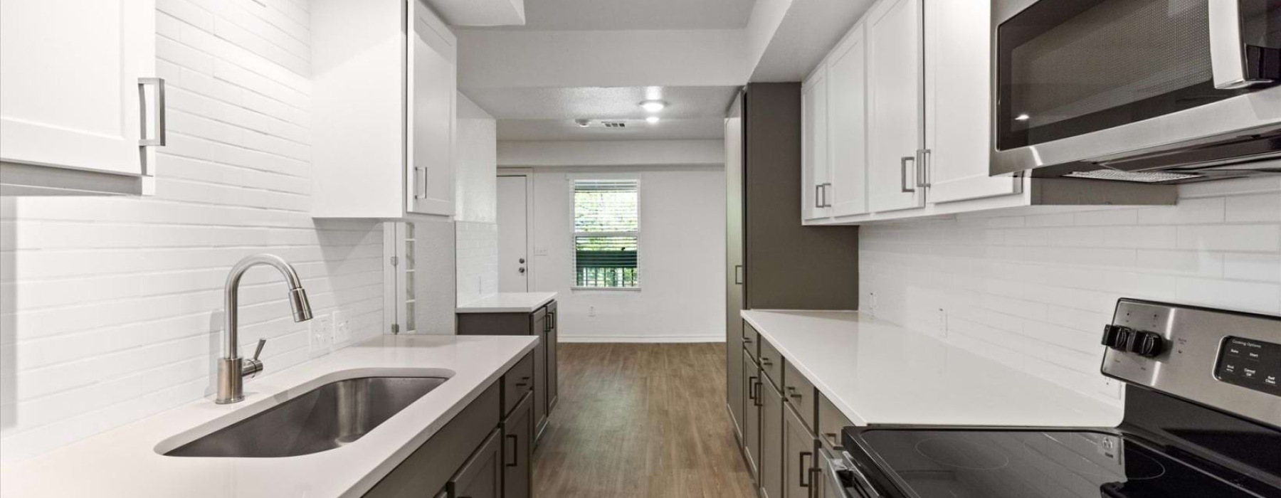a kitchen with white cabinets